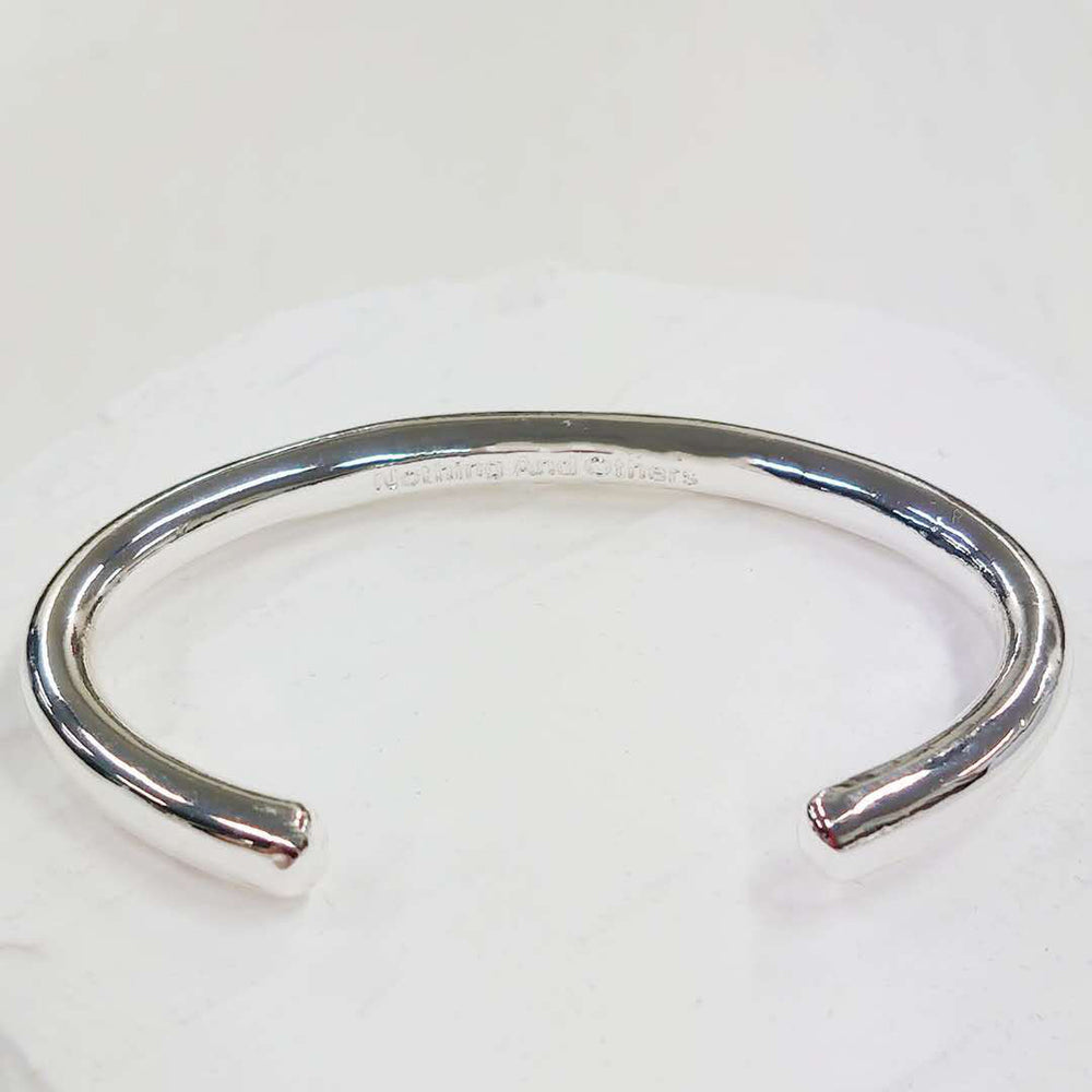 
                  
                    Nothing And Others/Plane Bangle
                  
                