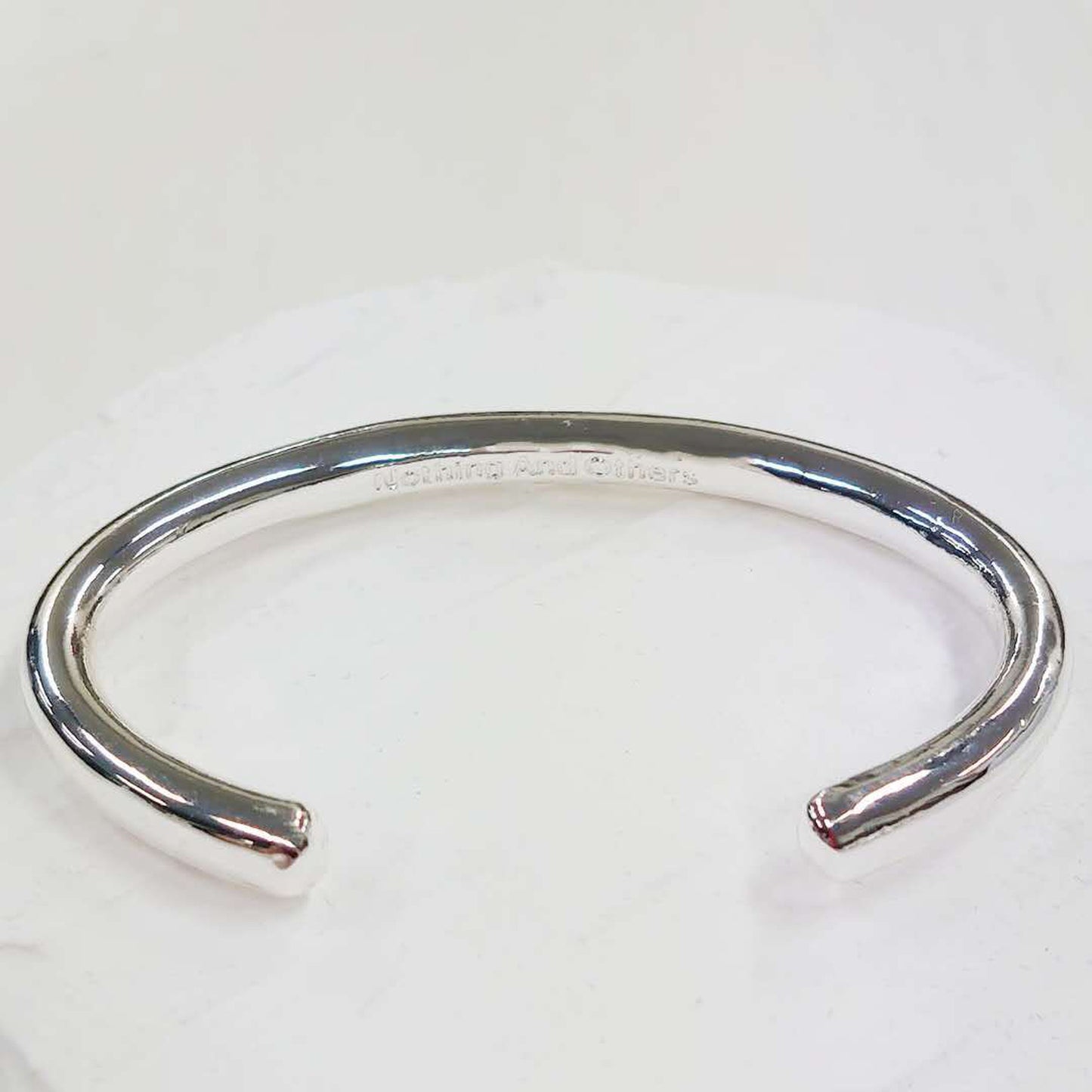 
                  
                    Nothing And Others/Plane Bangle
                  
                