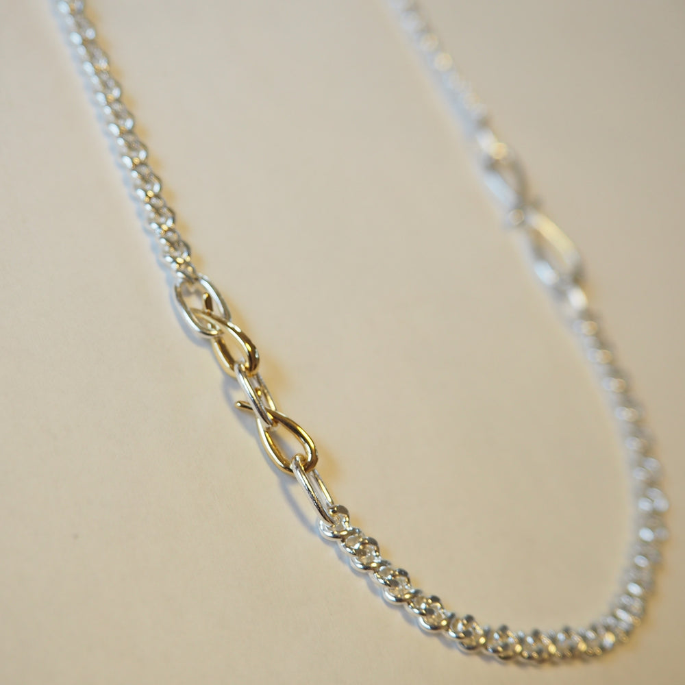 
                  
                    Turning Motif Chain Necklace 
                  
                