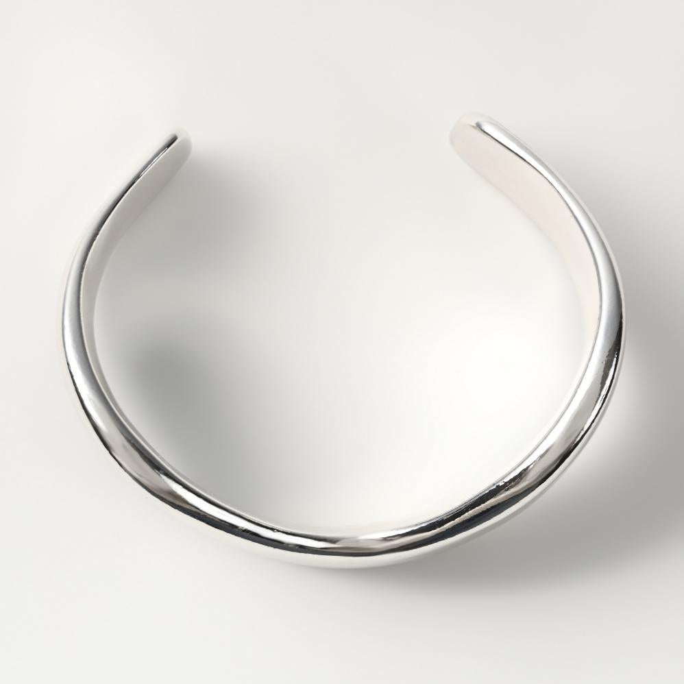 
                  
                    Thickness asymmetry wave Bangle
                  
                